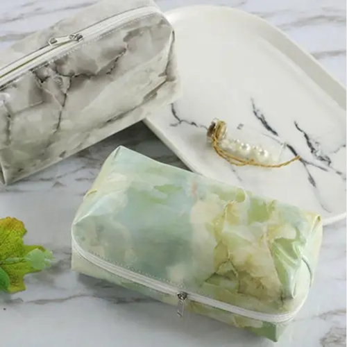 Gold foil logo branding option on premium marble print makeup bag